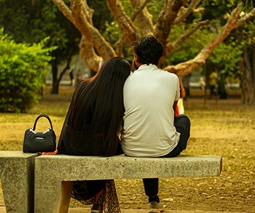 A couple sitting on a bench